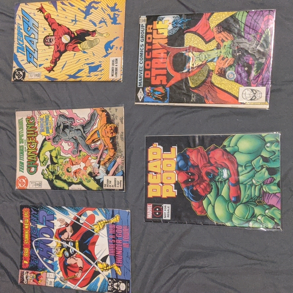 Five marvel/DC comic books (never been opened)